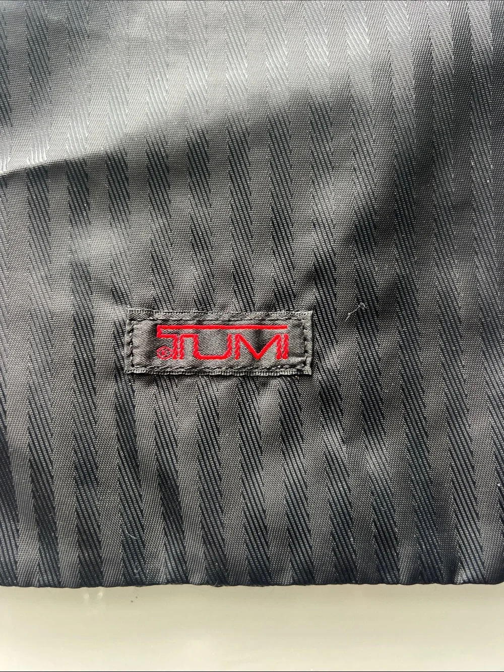 Tumi Black Drawstring Pouch with Red Logo
